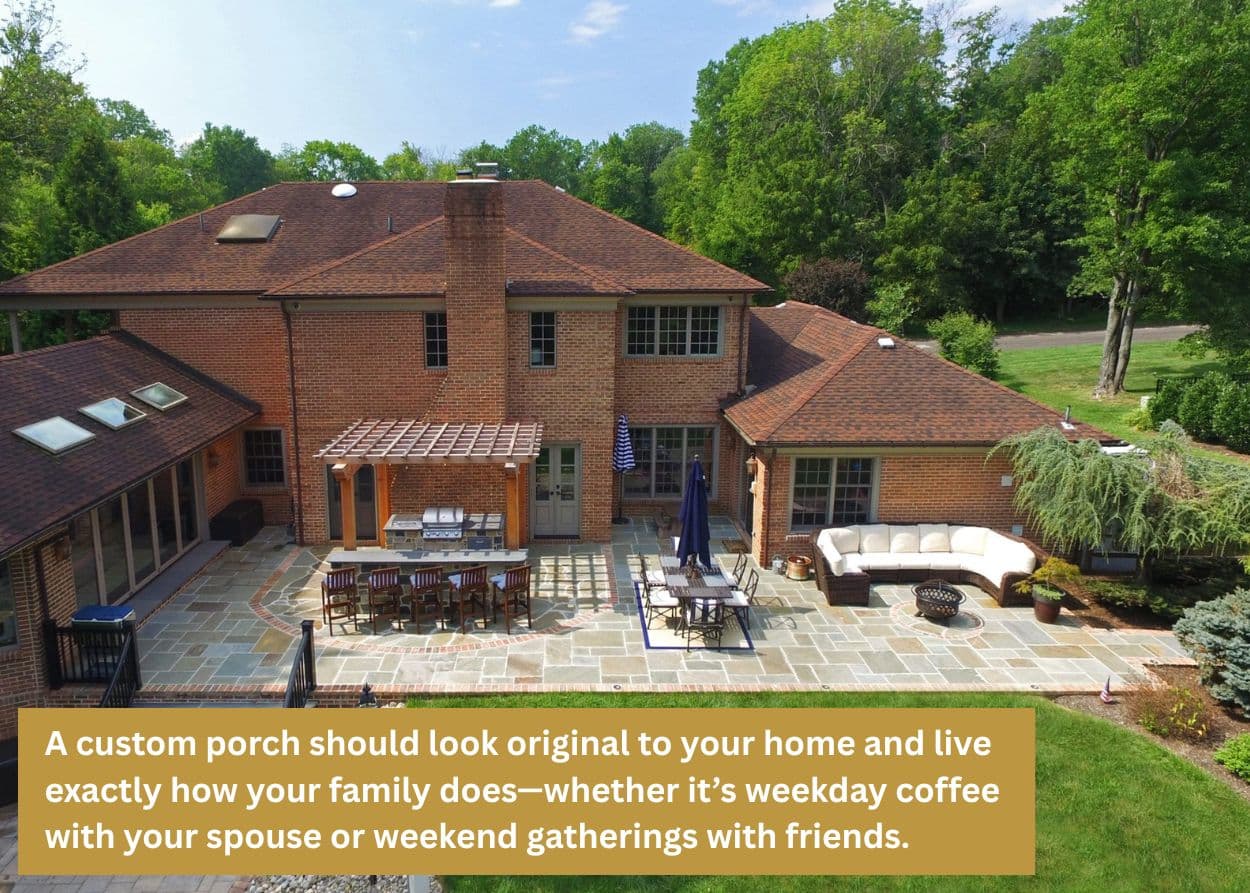 Large brick home with expansive patio featuring a pergola, outdoor kitchen, dining area, and lounge seating. Caption: A custom porch should look original to your home and live exactly how your family does—whether it’s weekday coffee with your spouse or weekend gatherings with friends.