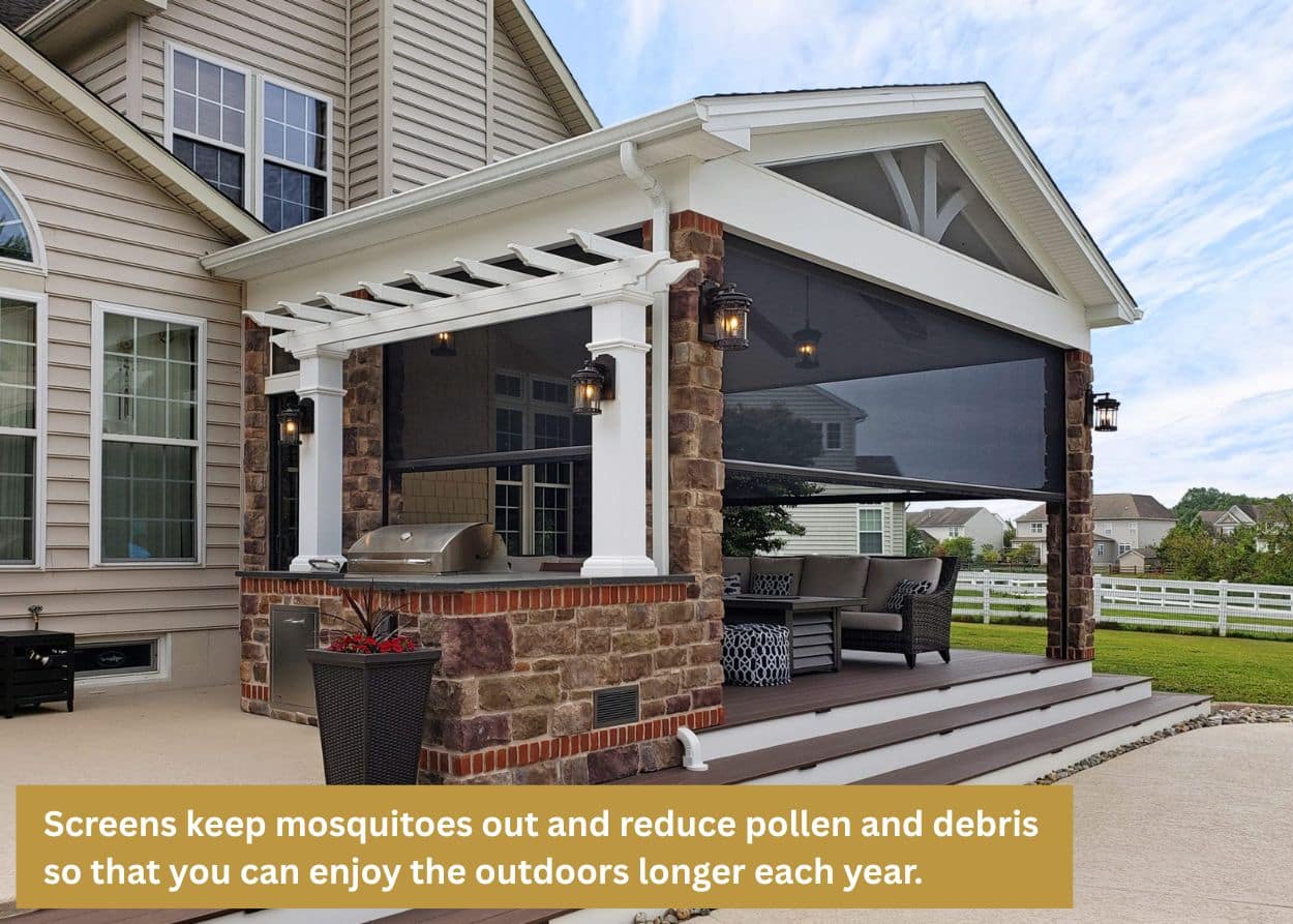 Covered porch with stone pillars, a built-in grill, and retractable screens providing shade and bug protection. Caption: Screens keep mosquitoes out and reduce pollen and debris so that you can enjoy the outdoors longer each year.