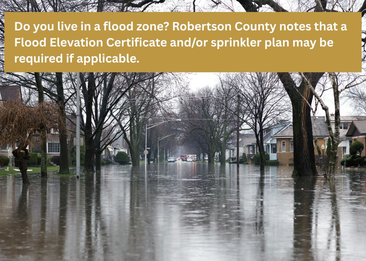 Flooded Tennessee neighborhood street highlighting importance of proper deck permits, drainage planning, and local building codes in Robertson County TN