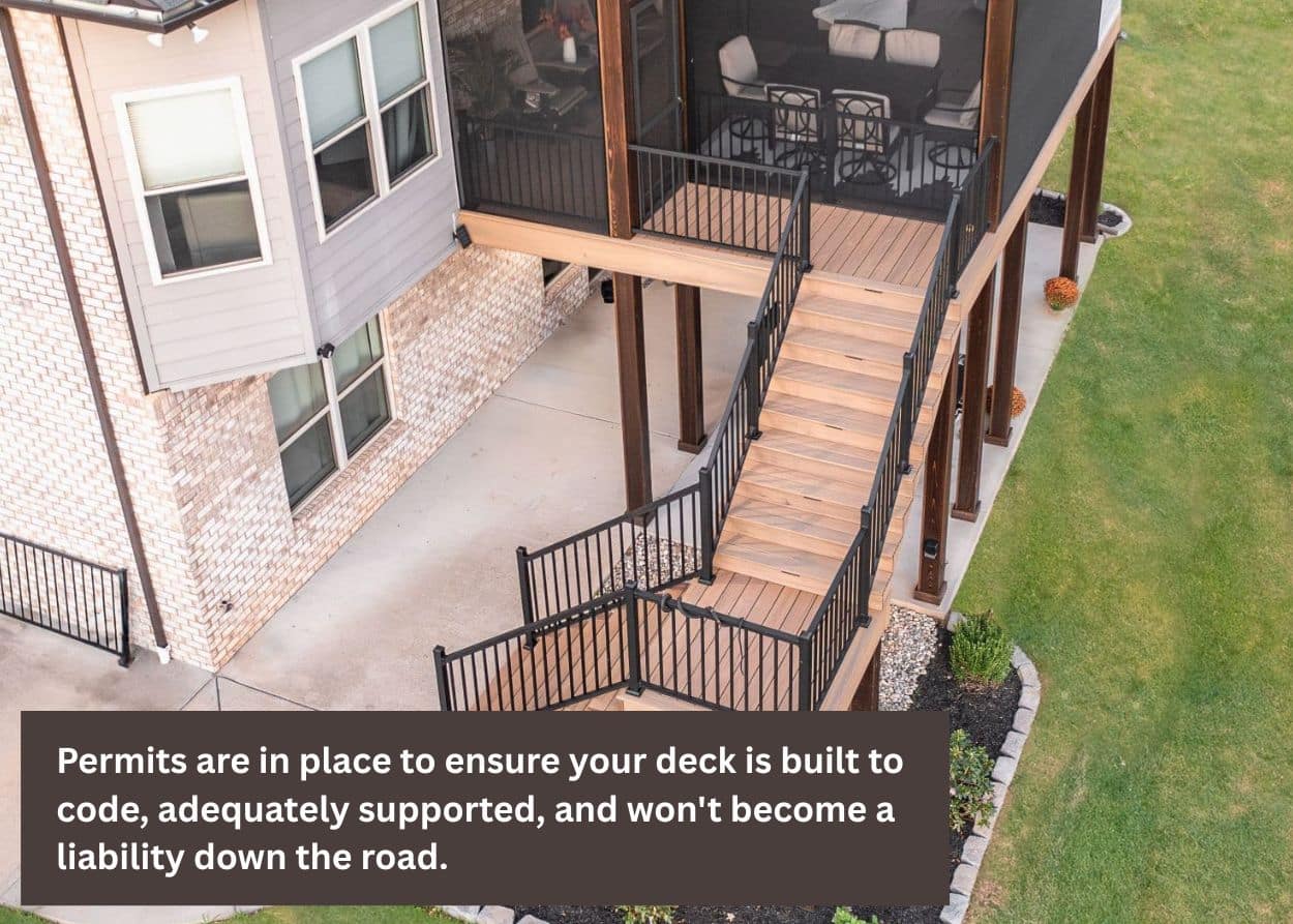 Elevated backyard deck with stairs attached to house.