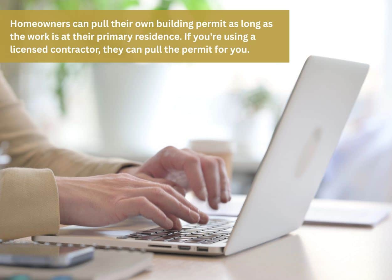 Homeowner using a laptop to complete a deck permit application and submit building documents online
