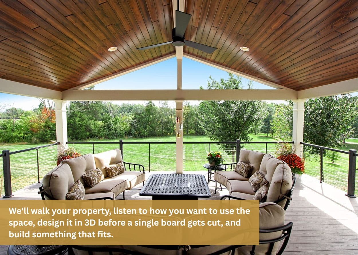 Covered deck with vaulted wood ceiling, cable railings, cushioned seating, and open views of a Tennessee property